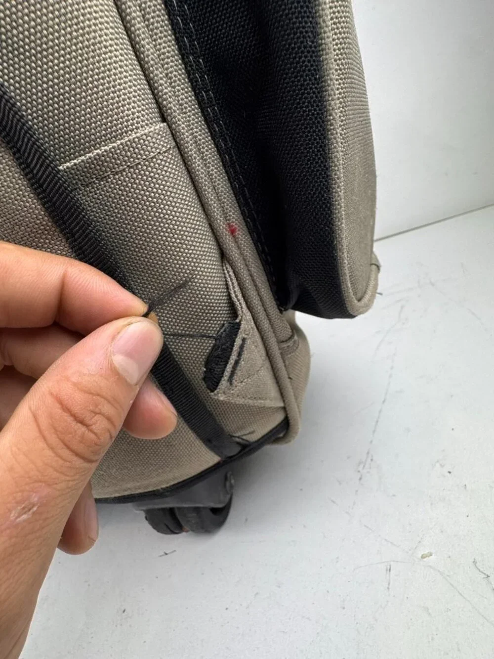 boy london rolling backpack tan wheeled suitcase travel bag tear fraying flaw